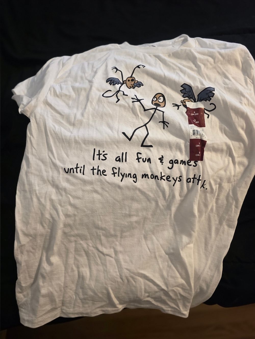 White Graphic Tee with Flying Monkeys Cartoon